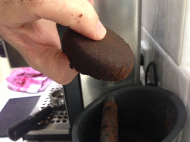 A uniformly dry coffee puck after extraction.